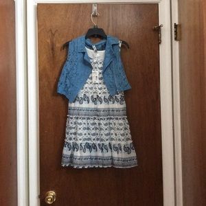 Paisley print dress with blue vest and necklace